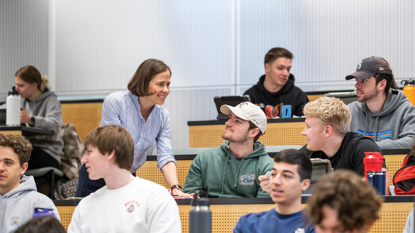 Carmen Swain assists students in a classroom