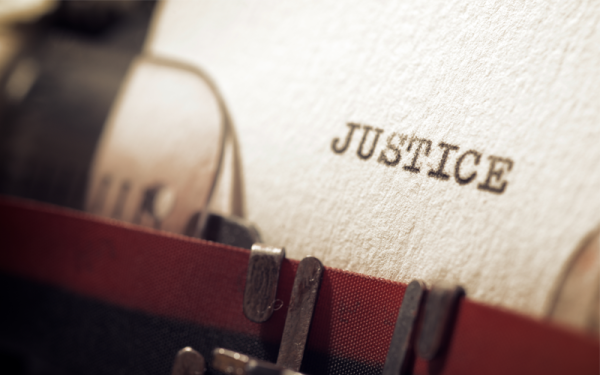 Paper with the word "justice" typed on it