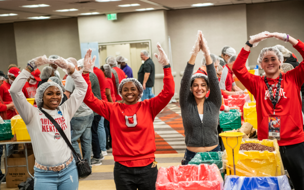 Student Life volunteer service project Feed the Funnel or Pack Shack packing meals